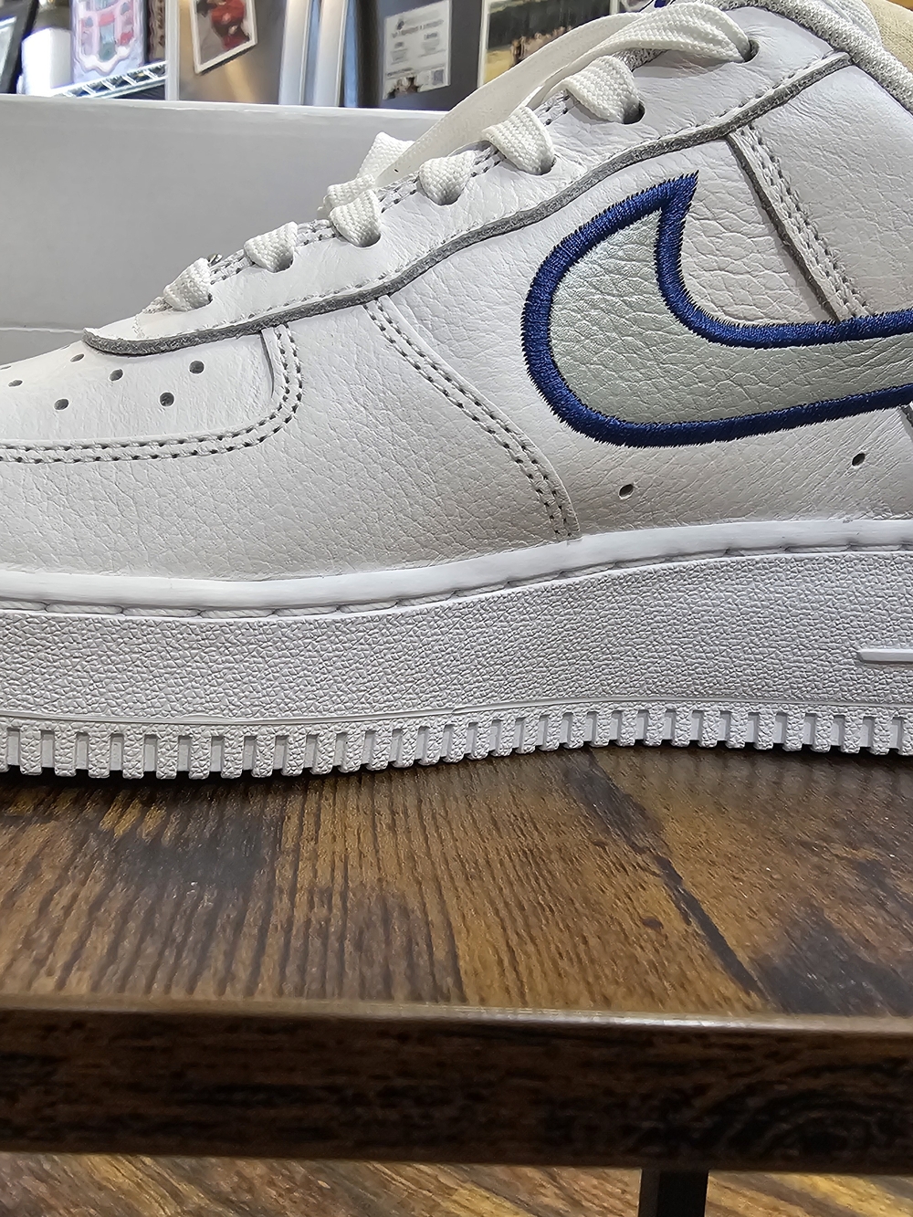 Nike Women’s White Low-Top Sneakers with Blue Swoosh